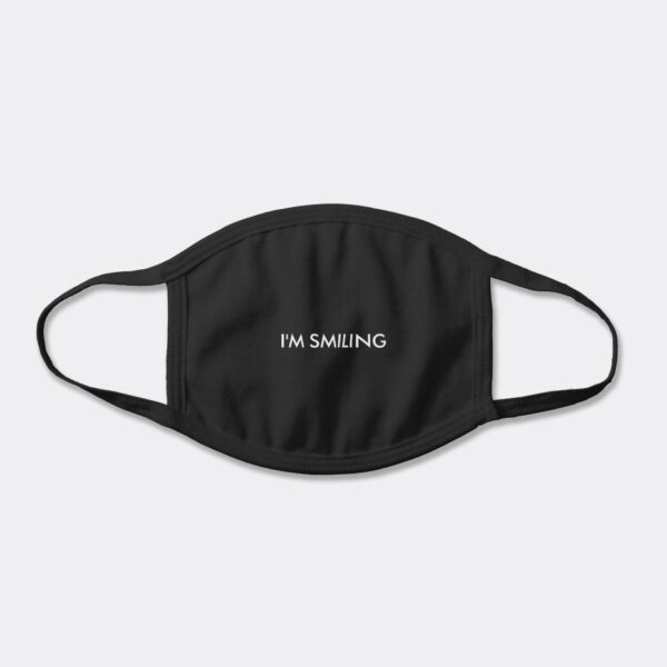 Black cotton face mask with the words "I'm Smiling" printed in white letters across the front.